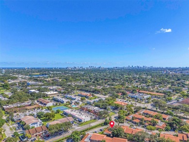 Corner one-level townhome in the sought-after Emerald Hills