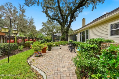 Nestled beneath a canopy of Mandarin oak trees, this