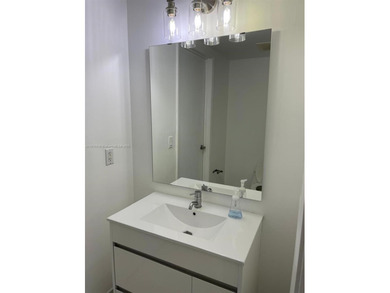 Experience luxury high-rise living in this beautifully updated