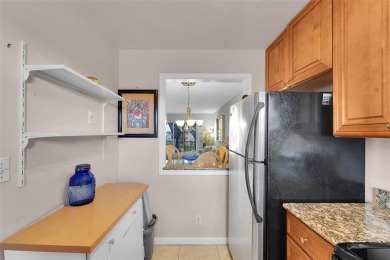 Welcome to this bright and spacious third-floor condo in a