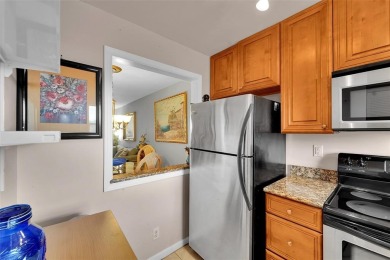 Welcome to this bright and spacious third-floor condo in a