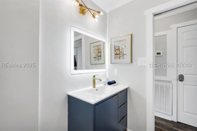 Step into coastal luxury at Admirals Row A1, a first-floor end