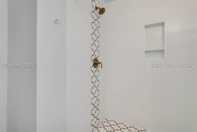 Step into coastal luxury at Admirals Row A1, a first-floor end