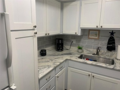 Welcome to this partially furnished 2nd floor condo located in a