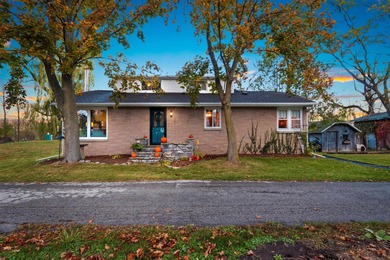 Charming brick home set on nearly 4 acres with 179' of Bay