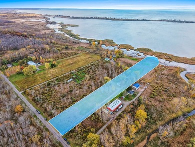 Charming brick home set on nearly 4 acres with 179' of Bay