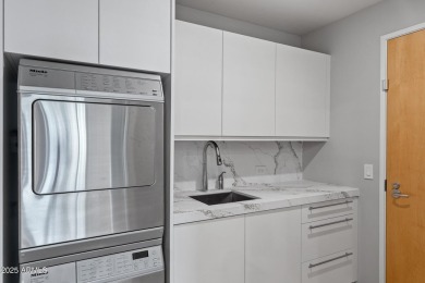 Rare unit with two expansive patios showcasing spectacular