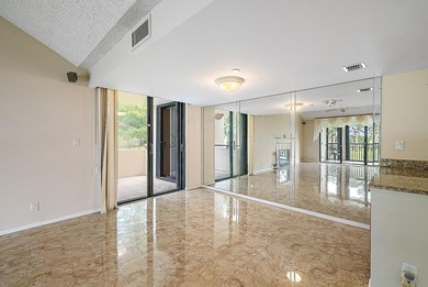 Spacious 2-bedroom, 2-bath condo with high ceilings, no one