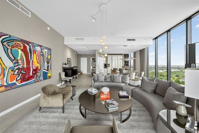Positioned on a premier penthouse level, this residence