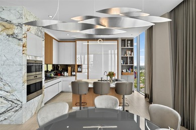 Positioned on a premier penthouse level, this residence