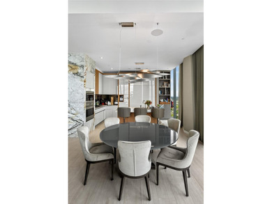 Positioned on a premier penthouse level, this residence