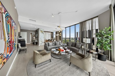 Positioned on a premier penthouse level, this residence