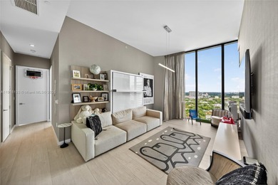 Positioned on a premier penthouse level, this residence