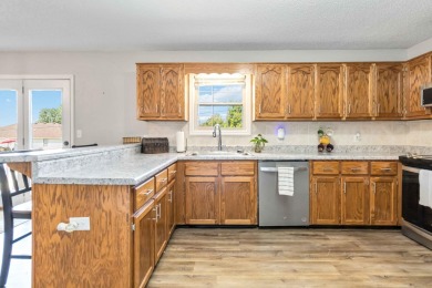 Welcome to this charming 3-bedroom, 2-bath ranch brick home