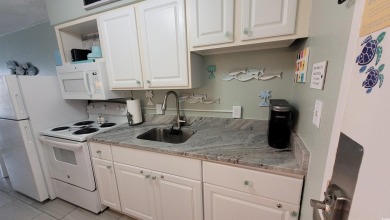 Elevate your beachside getaway with this beautiful efficiency