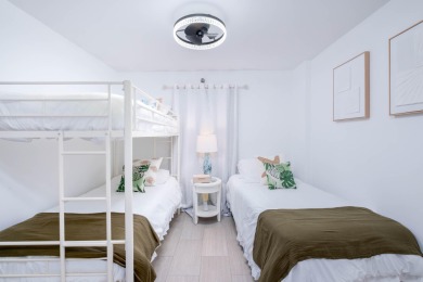 Professionally remodeled and fully furnished, this stunning unit