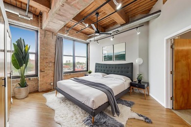 Step into a dramatic timber-loft masterpiece featuring 13-foot