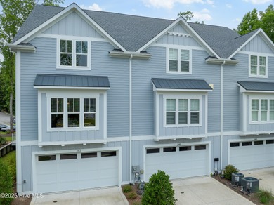 Serene river views await in this gorgeous end-unit