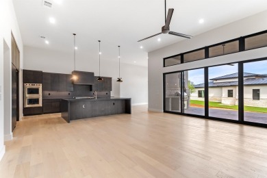 Welcome to 100 Spice Lily, an exceptional new construction home