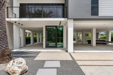 A modern sanctuary on the water, this newly built Key Largo