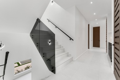 A modern sanctuary on the water, this newly built Key Largo