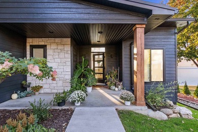 Experience modern-luxury lakeside living in this stunning home