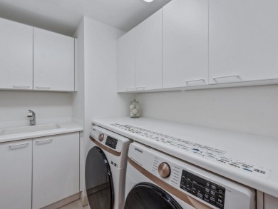 Experience refined coastal living in this elegant residence at