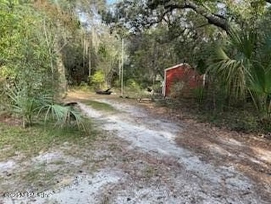High and dry acreage, quiet natural surroundings, frontage on