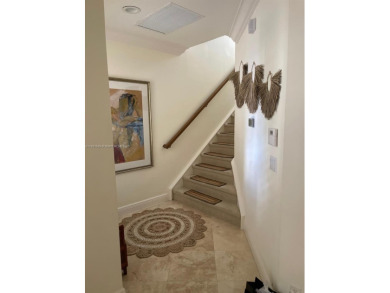 Stunning 3-story corner townhouse with private elevator in