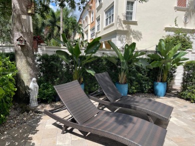 Stunning 3-story corner townhouse with private elevator in