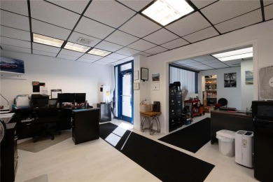 Excellent location! Great stucco retail building divided in 2