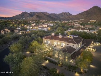 Welcome to 10163 E. Hualapai Drive, a timeless estate nestled in