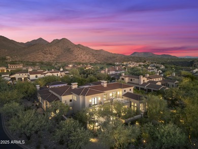Welcome to 10163 E. Hualapai Drive, a timeless estate nestled in