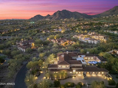 Welcome to 10163 E. Hualapai Drive, a timeless estate nestled in