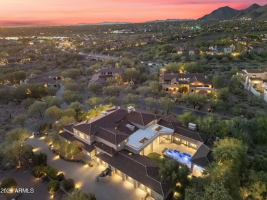 Welcome to 10163 E. Hualapai Drive, a timeless estate nestled in