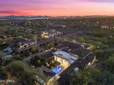 Welcome to 10163 E. Hualapai Drive, a timeless estate nestled in