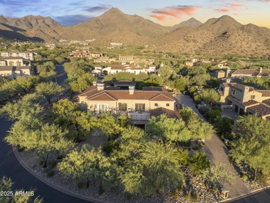 Welcome to 10163 E. Hualapai Drive, a timeless estate nestled in
