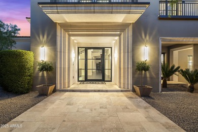 Welcome to 10163 E. Hualapai Drive, a timeless estate nestled in