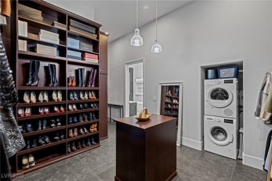 Wake up to panoramic golf course views at this custom home