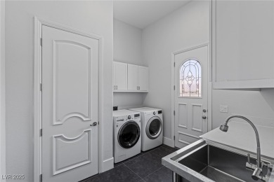 Wake up to panoramic golf course views at this custom home