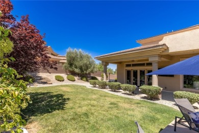 Wake up to panoramic golf course views at this custom home