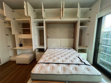 This studio unit is located on the Penthouse-level of the podium