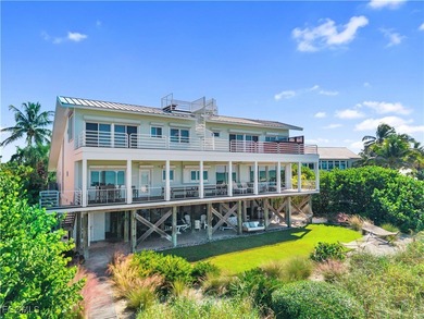 Welcome to a stunning coastal-modern beachfront estate on