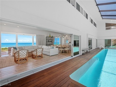 Welcome to a stunning coastal-modern beachfront estate on