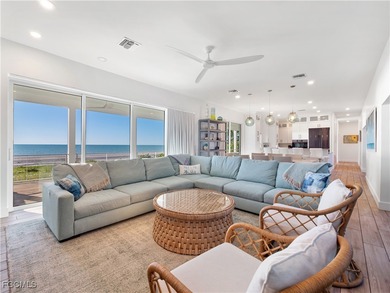 Welcome to a stunning coastal-modern beachfront estate on