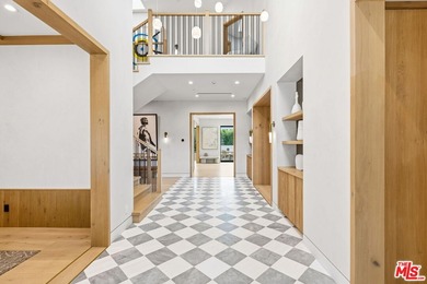 1220 Corsica Drive is a striking new custom estate nestled in