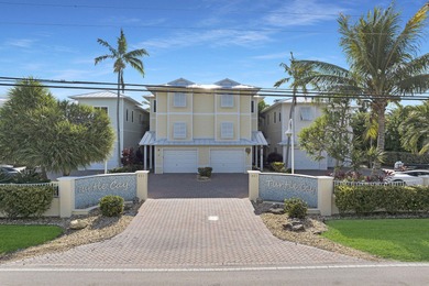 Welcome to Turtle Cay.   This exclusive townhome beachfront