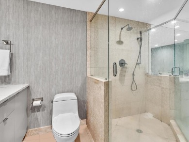 Experience luxury oceanfront living in this renovated 2-bedroom