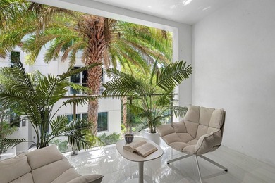 Coastal charm meets elevated elegance at this four-level, modern