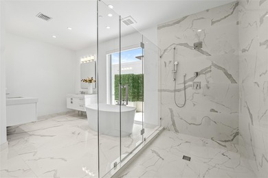 Coastal charm meets elevated elegance at this four-level, modern